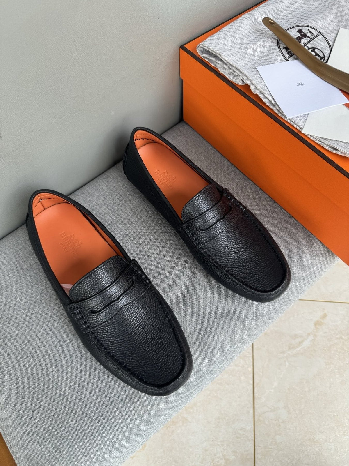 Hermès Black Textured Penny Loafers — front